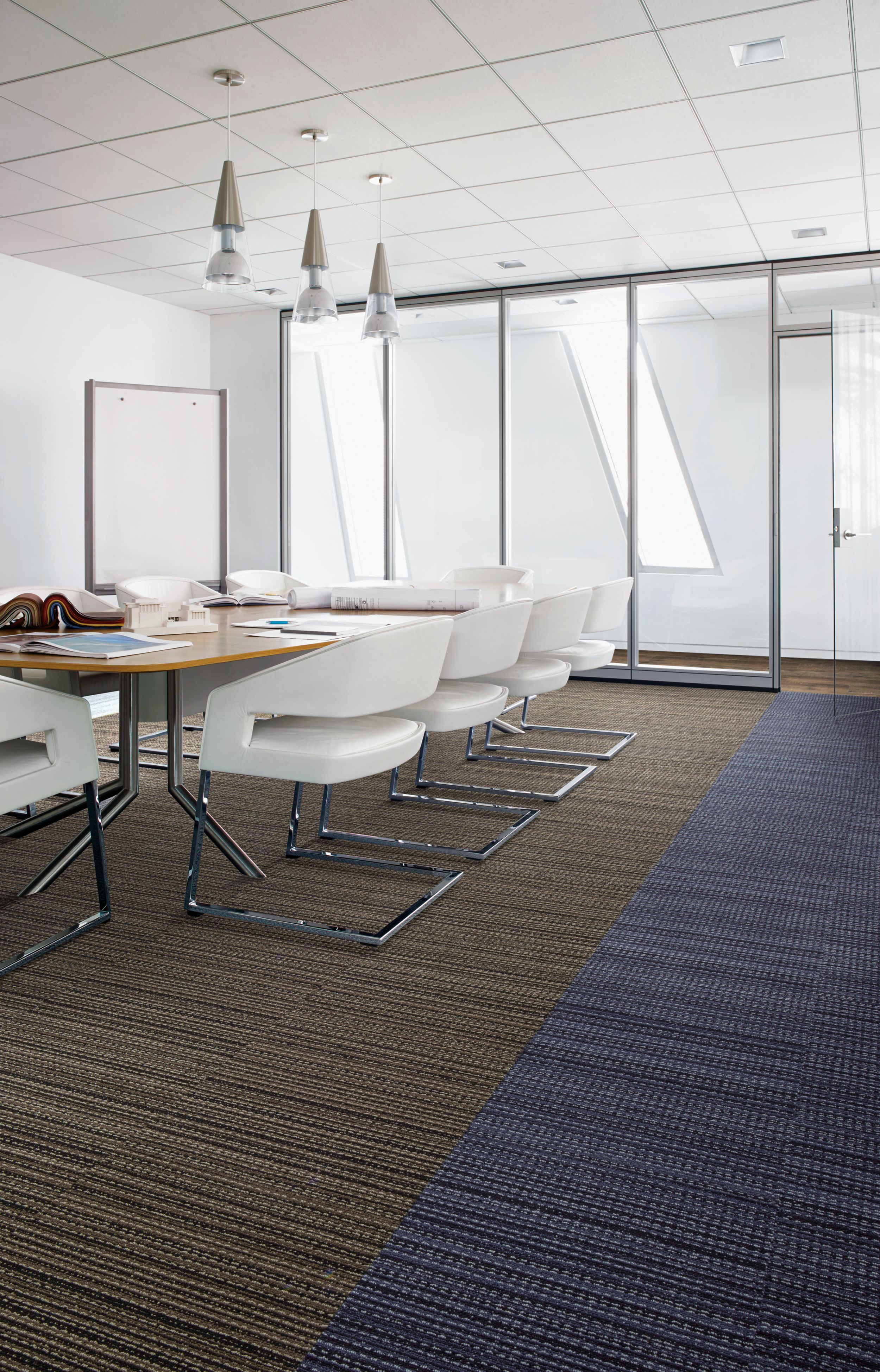 Interface La Paz carpet tile and Textured Woodgrains LVT in glass-enclosed meeting area with white chairs image number 2